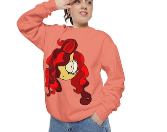 May include: Coral-colored sweatshirt featuring a cartoon illustration of a character with red hair and a yellow face. The long-sleeved top is made of a soft material and is suitable for casual wear. The graphic design is centered on the front of the shirt.