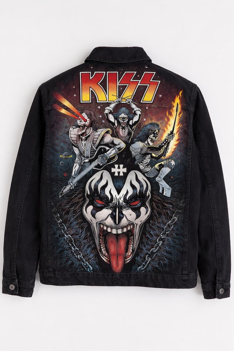 May include: Black denim jacket featuring a colorful graphic of the rock band KISS. The design includes the band's logo and illustrations of the band members in their iconic makeup and costumes. The jacket has a button-up front and two chest pockets.