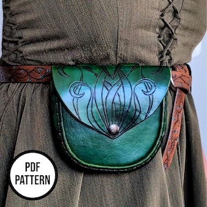 May include: A green leather pouch with an embossed floral design, secured with a silver-colored stud. The pouch is attached to a brown leather belt with decorative tooling. The image includes the text "PDF PATTERN" in a white circle.