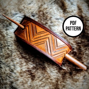 May include: A leather hair stick with a chevron pattern and a wooden dowel. The hair stick is on a brown faux fur background. The text "PDF PATTERN" is in a circle on the image.