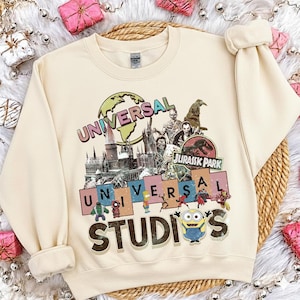 May include: A set of three ceramic mugs with a speckled, matte finish. The mugs are in shades of cream, light gray, and dark gray. Each mug has a simple, minimalist design, perfect for coffee or tea.