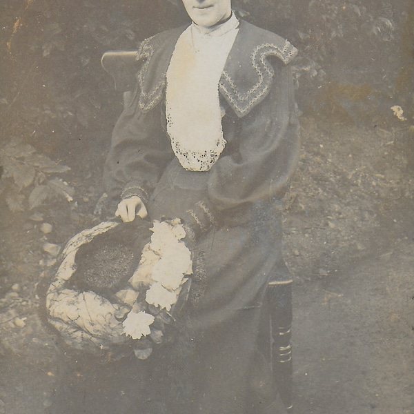 RPPC, Vintage Photograph,Young Lady, Flowers on Hat, Dark Dress, Frills, Lace Panels, Chair in Garden