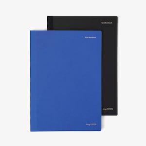 May include: Two grid notebooks, one blue and one black, are stacked on a white surface. The blue notebook is in front, with the text "tiny GRIDS" and "Grid Notebook" printed on it. The black notebook has the text "Grid Notebook" and "tiny GRIDS" printed on it.