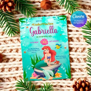 May include: An invitation to a birthday party for a girl named Gabriella. The invitation features a mermaid illustration with a pink seashell and the text "Join us Under The Sea Gabriella is turning six October 12 at 3:00pm 890 Playful Park Road, Funville, CA 90210 RSVP to Emma 123-555-7890".
