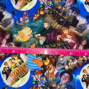 May include: A colorful fabric featuring a collage of movie scenes, including "The Briney Boys", "Bedknobs and Broomsticks", and "The Sound of Music". The fabric is a mix of blue, red, yellow, green, and white.