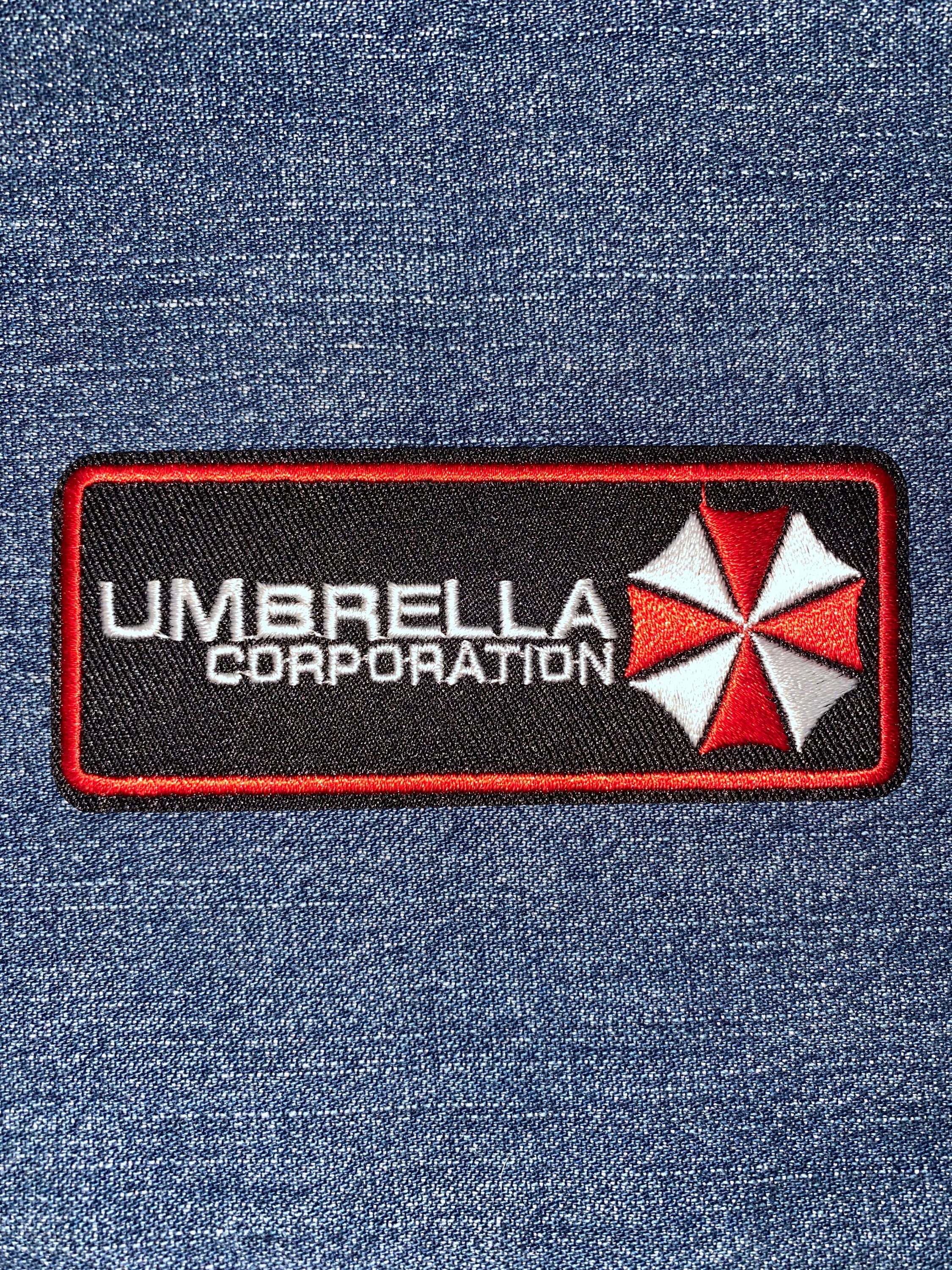 Umbrella Corporation Our Business Is Life Itself Patch - PVC Klett Abzeichen, Weiß