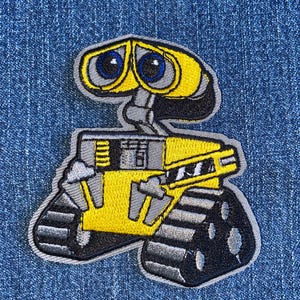 May include: Embroidered patch featuring the character Wall-E from the animated film. The patch showcases Wall-E's yellow and gray body, large blue eyes, and black treads. The patch is designed to be ironed on or sewn onto fabric.