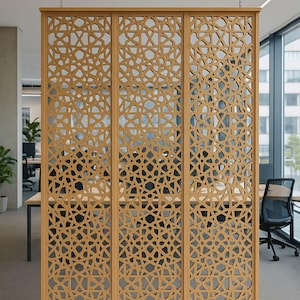 May include: A wooden room divider with a geometric pattern. The divider is made of three panels and is suspended from the ceiling by chains. The design is a series of interconnected shapes, creating a decorative screen. The color is a light brown.