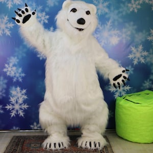 Disfraz de mascota «Oso polar blanco» con vestido. Mascot World Corporation ofrece la producción de disfraces de mascota ecológicos. Disfraces de mascota personalizados