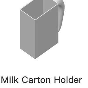 May include: A gray plastic milk carton holder with a handle. The holder is designed to hold a standard-sized milk carton. The text "Milk Carton Holder v2_plate_1.3mf" is printed on the bottom of the image.