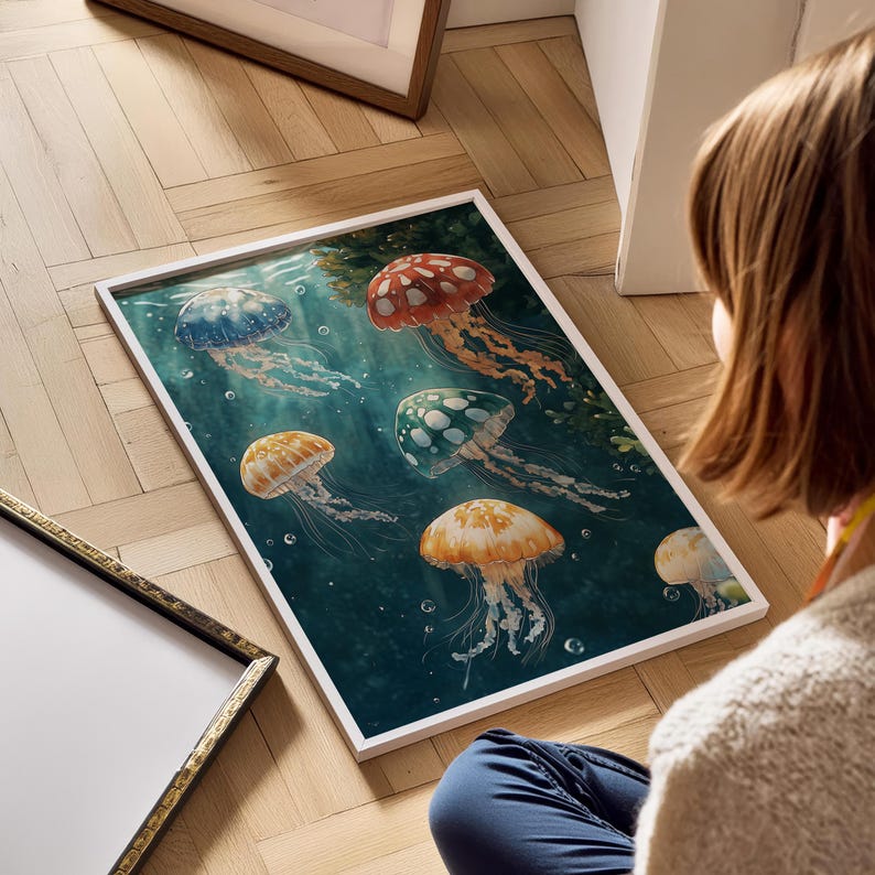 May include: A framed rectangular art print featuring a deep teal underwater scene with five jellyfish in shades of red, blue, orange, and green. Each jellyfish has a distinct spotted pattern on its bell and long, flowing tentacles drifting.