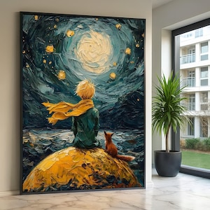 May include: Large framed art print depicting a scene from "The Little Prince." A young figure with blonde hair and a yellow scarf sits with a fox on a yellow planet, gazing at a swirling moon in a dark blue sky. The artwork has a textured, painted appearance.