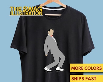 Puede incluir: Camiseta negra con una ilustración estilizada de un hombre con traje gris, pajarita roja y zapatos blancos. El texto "THE SWAG ILLUSTRATION" está encima del gráfico. El texto adicional dice "MORE COLORS" y "SHIPS FAST".