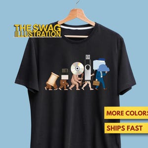 May include: Black t-shirt with a humorous illustration depicting the evolution of technology. The design shows figures representing storage devices like a spool of thread, floppy disk, CD, and USB drive. The text "THE SWAG ILLUSTRATION" is at the top.