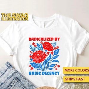 May include: White t-shirt featuring a red and blue floral design and the text "RADICALIZED BY BASIC DECENCY." The Swag Illustration logo is visible. The shirt is displayed with blue denim jeans.