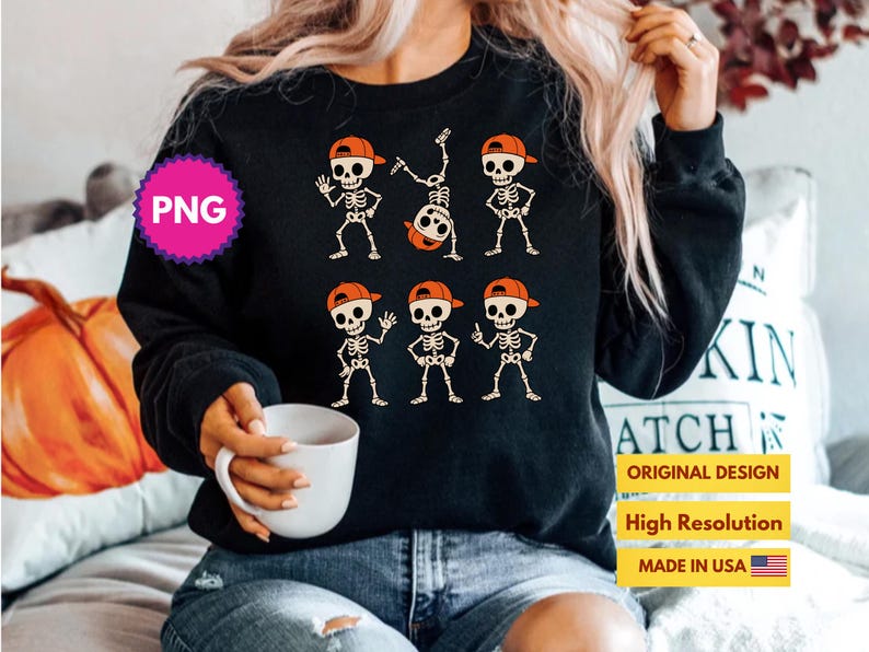 May include: Black sweatshirt featuring a skeleton graphic wearing orange caps. The skeletons are in various poses. The design includes the text "ORIGINAL DESIGN", "High Resolution", and "MADE IN USA".