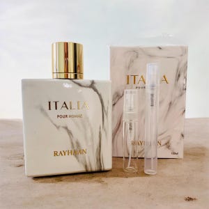 May include: A white and gray marble-patterned perfume bottle with a gold cap, labeled "ITALIA POUR HOMME RAYHAAN." Includes two small clear spray bottles and a marble-patterned box with "ITALIA POUR" printed on it.
