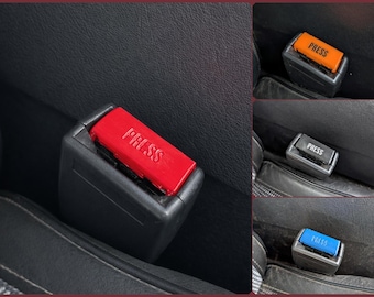 Seatbelt buttons multiply color For Volvo 240, 260, 740, 760, 850, 940, 960, C70, S90, V90, Saab 900, 9000. Replaces Part Number: 9188778.