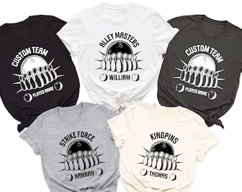 May include: Five t-shirts in various colors, each featuring a bowling-themed graphic. The designs include bowling pins, bowling balls, and text such as "CUSTOM TEAM", "ALLEY MASTERS", "STRIKE FORCE", and "KINGPINS", with customizable player names.
