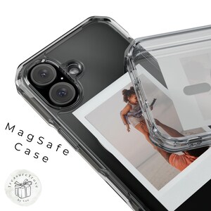 May include: A clear phone case with a built-in photo holder. The case is designed to fit a smartphone with a dual camera system. The photo holder is a clear plastic frame that can hold a standard-sized photograph. The case is labeled "Magsafe Case".