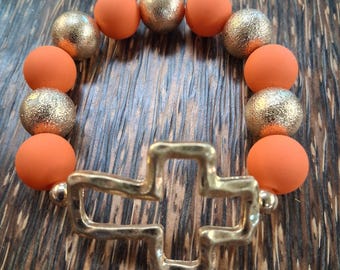 Matte Gold Cross Stretch Bracelet with Chunky Orange Beads