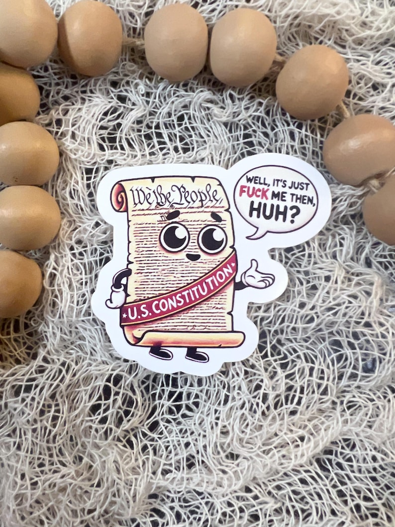 Funny political sticker featuring a cartoon version of the U.S. Constitution with big eyes and a speech bubble that says, ‘Well, it’s just fuck me then, huh?’ The Constitution is holding up its hands in exasperation, with a ‘U.S. Constitution’ banner wrapped around it. A satirical design about government disregard for constitutional rights.