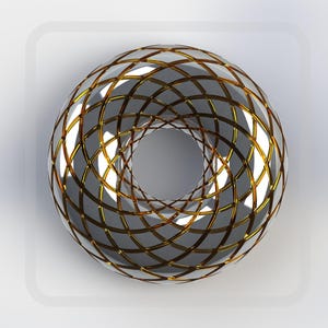 Könnte beinhalten: Eine silberne und goldene Kugel mit einem geometrischen Muster. Die Kugel hat ein Loch in der Mitte, wodurch eine Donut-Form entsteht.
