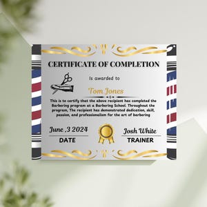 May include: A silver certificate of completion with a gold border and a barber pole design on the sides. The certificate reads "Certificate of Completion" and is awarded to "Tom Jones". The date is June 3, 2024, and the trainer is "Josh White".