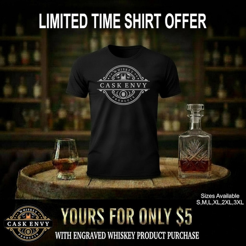 May include: Black t-shirt with a white circular logo that reads "Cask Envy Products" and "Whiskey". The image includes a whiskey glass, a decanter, and the text "Limited Time Shirt Offer". Sizes available: S, M, L, XL, 2XL, 3XL.