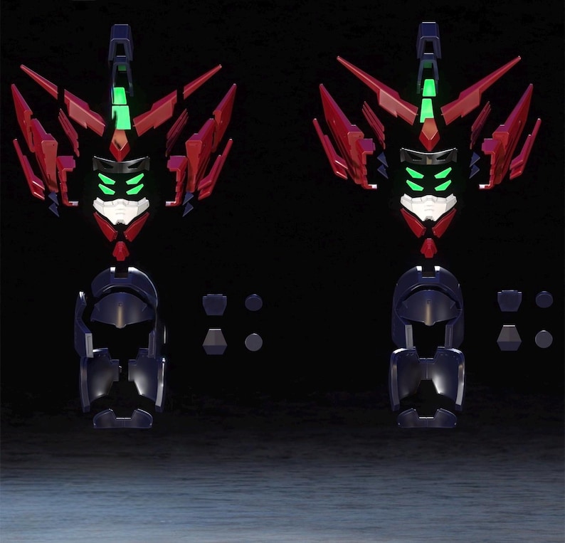 May include: Two robot model kits, each with a dark blue torso, red and black upper body, and green and white accents. The kits are partially assembled, with various components scattered around.