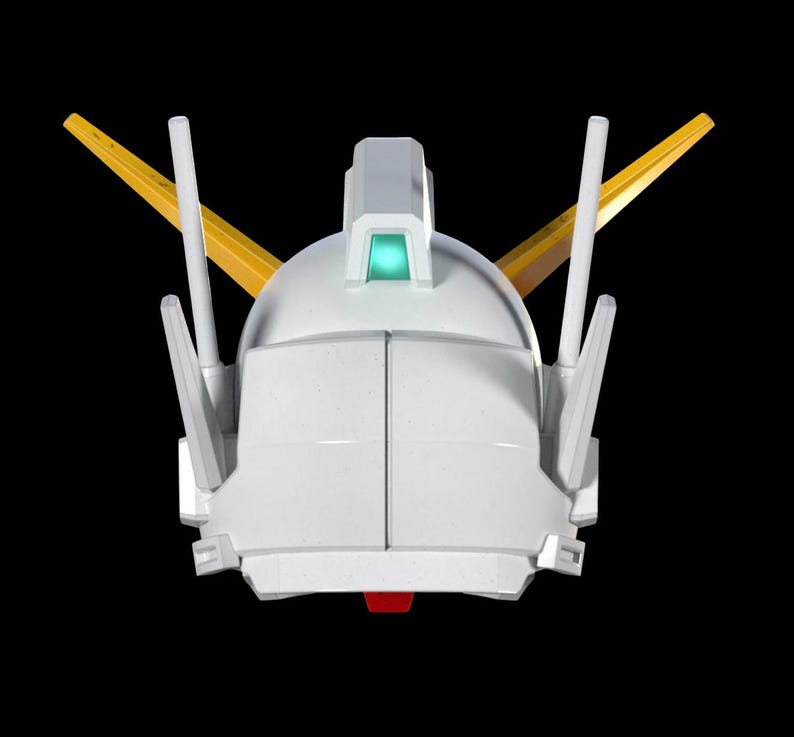 May include: A white robot head with yellow and white accents, and a red detail at the bottom. The head has a rounded top with a rectangular structure and a green light. Two yellow fins extend from the sides.