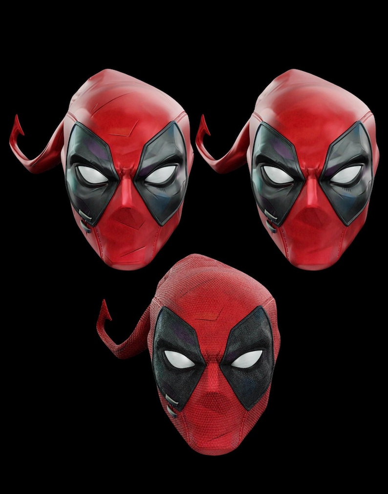 May include: Three red and black Deadpool masks are displayed against a black background. The masks have white eye shapes, black eye surrounds, and a red textured surface. The masks are a comic book and movie-themed item.
