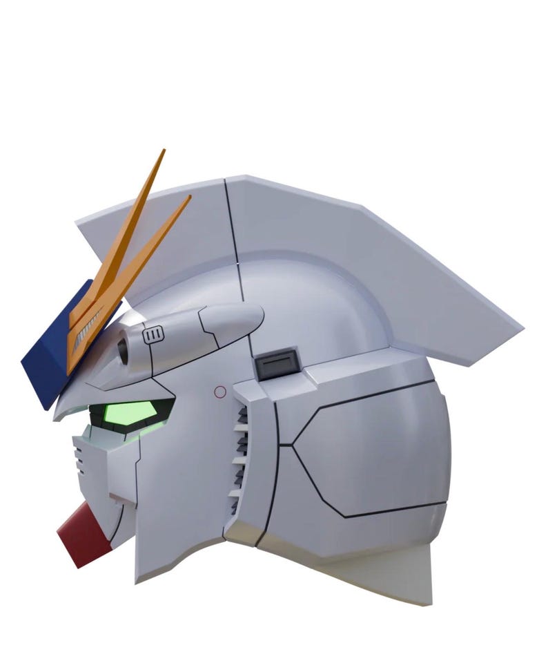 May include: A side profile of a white robot head with orange and blue accents. The robot head has a red mouth, green eyes, and a detailed design with black lines. The head is a stylized representation of a Gundam.