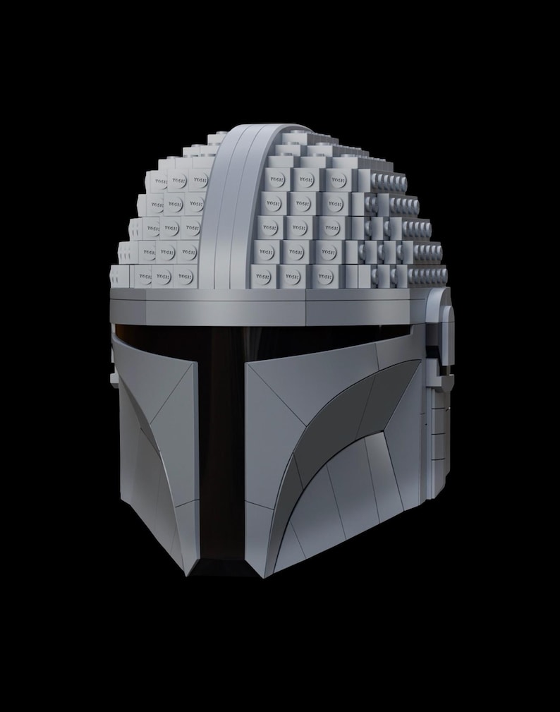 May include: A gray Mandalorian helmet constructed from small, square blocks, with a smooth, curved visor and a dark, vertical slit. The helmet's top is built with layered blocks, creating a textured surface. The design is set against a black background.