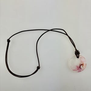 Handmade leather necklace with a pink glass pendant