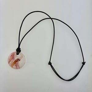 Handmade leather necklace with a pink glass pendant