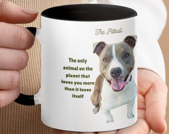 May include: White ceramic mug with a black interior and handle. The mug features a Pitbull dog illustration and the text "The Pitbull". The text on the mug reads "The only animal on the planet that loves you more than it loves itself."