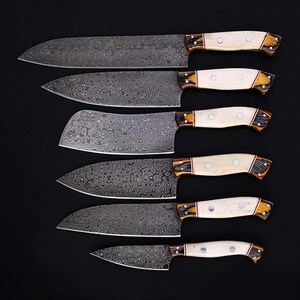Elegant Damascus Steel Chef Knife Set, handmade with high-carbon Damascus steel and a polished bone handle. Designed for both professional chefs and home kitchens, these knives offer superior sharpness and precision. Whether you're chopping, slicing, or dicing, this set provides a seamless cooking experience. A perfect wedding, anniversary, or groomsmen gift for those who appreciate quality.