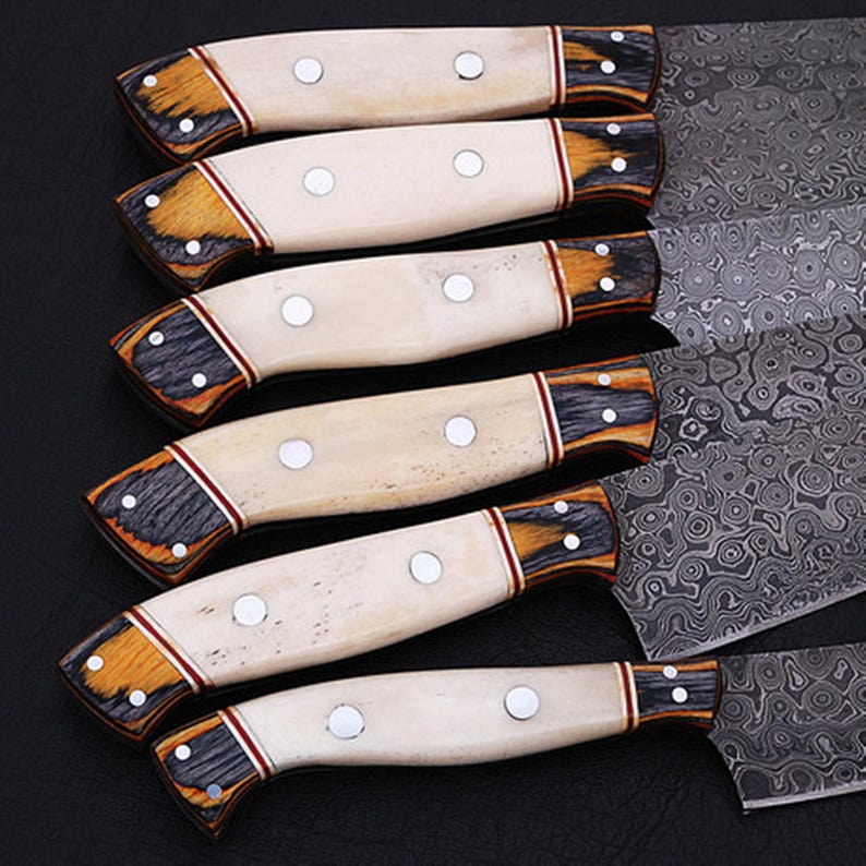 Premium Damascus Steel Kitchen Knife Set featuring a beautifully hand-forged blade with intricate patterns and a durable bone handle. These professional chef knives are ideal for precise cutting, offering exceptional sharpness and longevity. A must-have for culinary experts and home cooks, making it a thoughtful gift for birthdays, Father’s Day, and housewarming events.