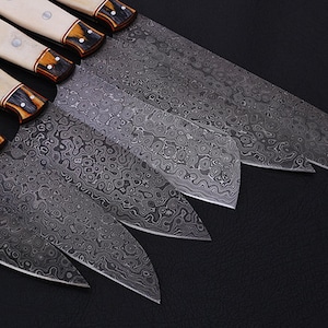 Exquisite Damascus Steel Chef Knife Set with a bone handle, designed for precision cutting in the kitchen. This high-quality knife set includes multiple sizes to handle all cooking tasks, from slicing meats to chopping vegetables. Ideal for home kitchens, professional chefs, and outdoor cooking. A luxurious handmade gift for chefs, food lovers, and those who appreciate fine craftsmanship.