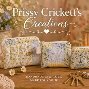 May include: Three quilted fabric pouches in varying sizes featuring floral patterns in yellow, blue, and white. Each pouch has a zipper closure and a side tab. The text Prissy Crickett's Creations and Handmade with love. Made for you. is visible.