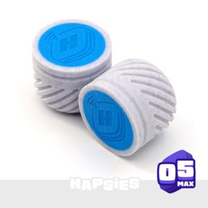 May include: Two white and blue cylindrical objects with a textured surface. The top of each cylinder is blue with a white "H" logo. The objects are labeled "Hapsies" and "05 MAX".