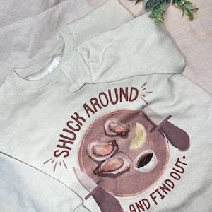 Cute Oyster Graphic T-shirt, &#39;Shuck Around and Find Out&#39;, shucked oyster shirt, funny oyster shirt, oyster lover gift