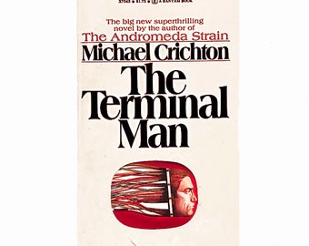May include: A book cover with a white background and black text. The title is "The Terminal Man" by Michael Crichton. The book is a novel by the author of "The Andromeda Strain".