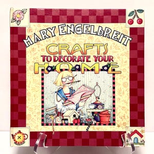 May include: A rustic wooden sign with the text "Welcome to our home" in white lettering. The sign features a distressed finish and a simple, inviting design, perfect for front door decor.