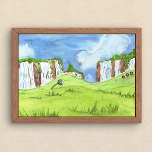 May include: Watercolor painting of a landscape with a green grassy field, cliffs, and a blue sky with clouds. The painting is in a wooden frame. A key-shaped object is in the foreground.