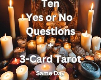 May include: A table lit by candles and featuring a Buddha statue, crystals, and a sign that reads "Ten Yes or No Questions + 3-Card Tarot Same Day".