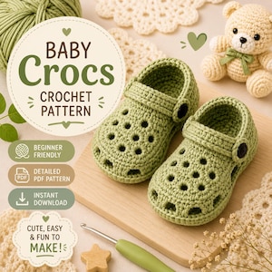 May include: A pair of sage green crocheted baby clogs with a heel strap and black button detail. The image includes text reading BABY Crocs CROCHET PATTERN, BEGINNER FRIENDLY, DETAILED PDF PATTERN, INSTANT DOWNLOAD, and CUTE, EASY & FUN TO MAKE!