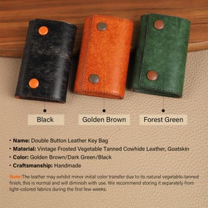 May include: Three leather key bags in black, golden brown, and forest green. Each bag has a double button closure. The bags are made of vintage frosted vegetable tanned cowhide leather and goatskin. The text below each bag reads "Black", "Golden Brown", and "Forest Green".