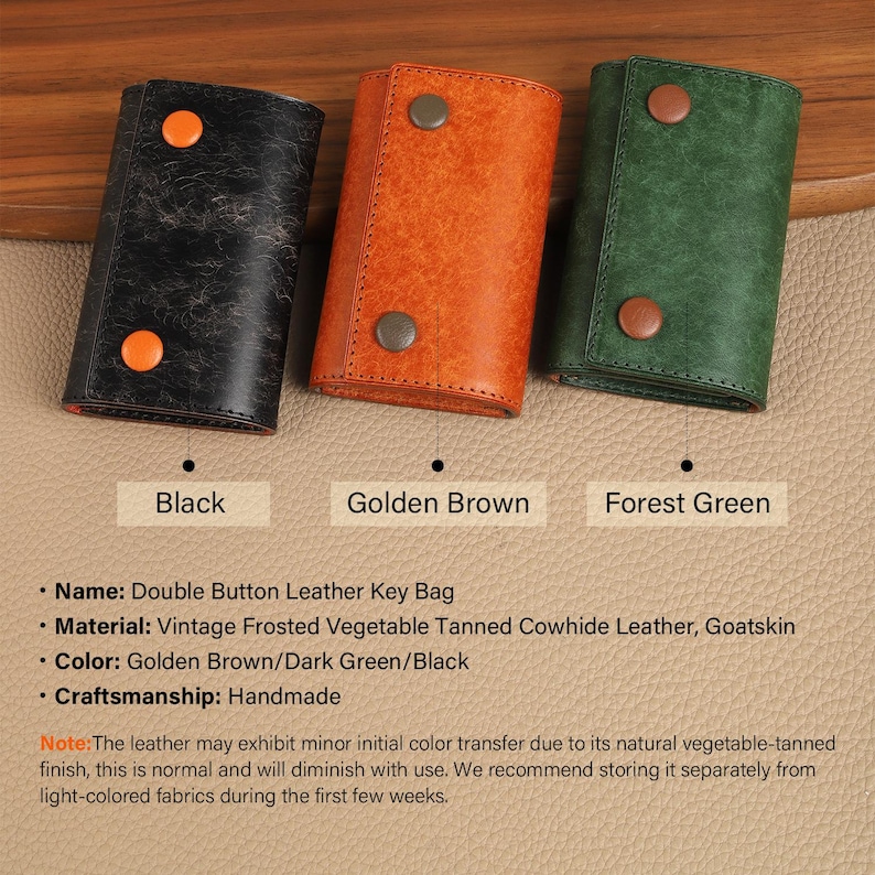 May include: Three leather key bags in black, golden brown, and forest green. Each bag has a double button closure. The bags are made of vintage frosted vegetable tanned cowhide leather and goatskin. The text below each bag reads "Black", "Golden Brown", and "Forest Green".